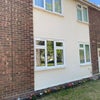 Photo 7: Front of house with small flower Garden. The Council mow the grass.