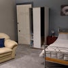 Photo 7: Our West guest room, showing bed and sofa