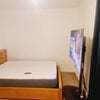 Photo 2: This is a Ottoman bed with storage beneath