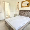 Photo 2: Double bedroom with TV.