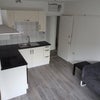 Photo 2: Kitchen/living area