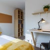 Photo 6: Photo 6: Comfortable, freshly decorated room with ample built-in shelving and storage.