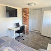Photo 1: Newly furnished Room with ample storage and desk & TV