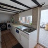 Photo 2: Kitchen, showing back yard