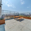 Photo 9: Communal BBQ area 