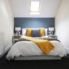 Photo 1: The bed is a storage bed so lots of additional space underneath