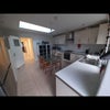 Photo 6: The ground floor kitchen with dining area