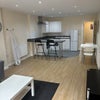 Photo 2: Kitchen aea with bar stools