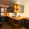 Photo 2: Kitchen and dining area