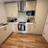 Photo 5: Kitchen with Dishwasher, Washing Machine and Large Refrigerator