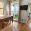 Photo 5: Dining room and kitchen