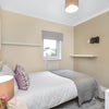 Photo 2: Room 5 - view to bed & window