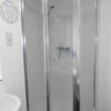 Photo 8: Good size shower in this clean and modern bathroom
