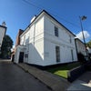 Photo 3: Characterful white stuccoued building with ample free parking at the rear.