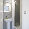 Photo 2: En Suite with Power Shower, sink, toilet & towel rail