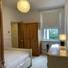 Photo 3: Double bedroom with window facing the garden and door connecting to the shared bathroom