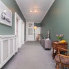 Photo 7: Spacious hallway with high ceilings and storage space.