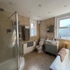 Photo 9: Family bathroom with shower and bath