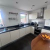 Photo 3: kitchen with Canary Wharf view