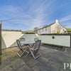 Photo 2: patio at rear of property
