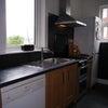 Photo 6: Kitchen with dishwasher, tall larder fridge, microwave, oven/hob