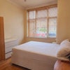 Photo 2: Bright and airy bedroom with large window 