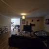 Photo 6: Living Area ft. TV and sofas