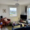Photo 1: Spacious Open Plan Living Room with Stunning Water Views & Private Balcony! 
