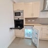 Photo 4: Kitchen with storage cabinets 