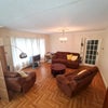 Photo 2: Bright and airy living area / Sofa X 3 / Table / TV