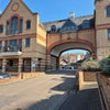 Photo 9: Entrance by car to the building