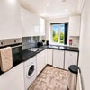 Photo 6: Upstairs kitchen