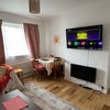 Photo 5: Our lovely living room w/ two couches & a small dining area 🍝