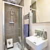 Photo 3: Private shower and basin inside of the room