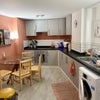 Photo 2: Shared kitchen and dining area 