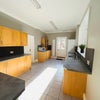 Photo 2: Shared kitchen looking towards back door