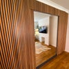 Photo 5: Wardrobes and wallbed behind mirror