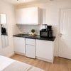 Photo 6: Fridge freezer, toaster, kettle, microwave and induction plug in hob provided.