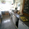Photo 5: ... spacious kitchen with a plethora of storage.