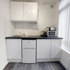 Photo 4: Fridge freezer, toaster, kettle, microwave and induction plug in hob provided.