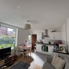 Photo 3: Shared living room/kitchen
