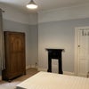 Photo 4: Bedroom with double bed and large office desk