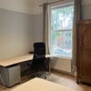 Photo 2: Bedroom with double bed and large office desk