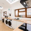 Photo 6: Your dream kitchen and laundry room!