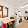 Photo 9: Your dream kitchen and laundry room!