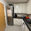 Photo 6: Shared kitchen showing large fridge freezer