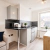 Photo 2: Fridge/freezer, toaster, kettle, microwave and induction plug in hob provided.