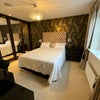 Photo 4: The ensuite is the master bedroom (largest) of the house.