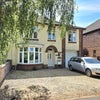 Photo 8: FRONT OF HOUSE WITH PARKING