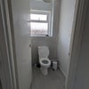 Photo 7: Upstairs Toilet